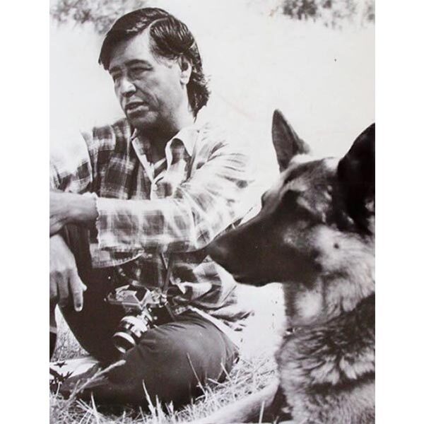 César Chávez with one of his pet German Shepherds