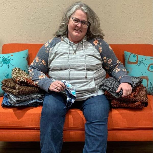 Gail Davis with blankets she made and donated to us
