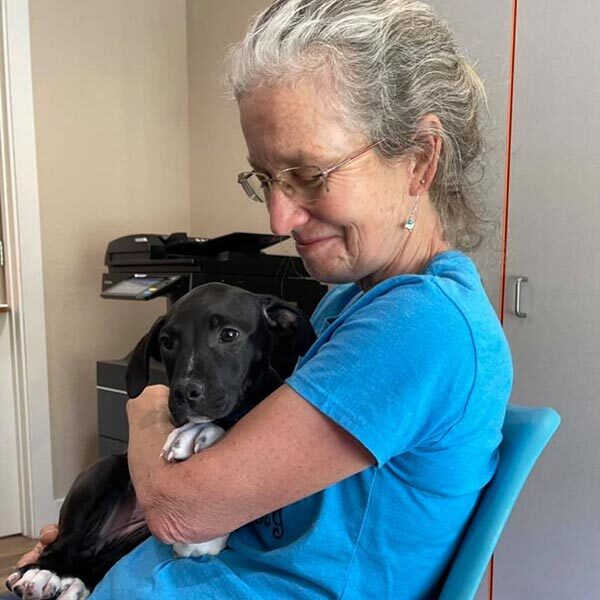 Volunteer Kathleen with puppy Sissy
