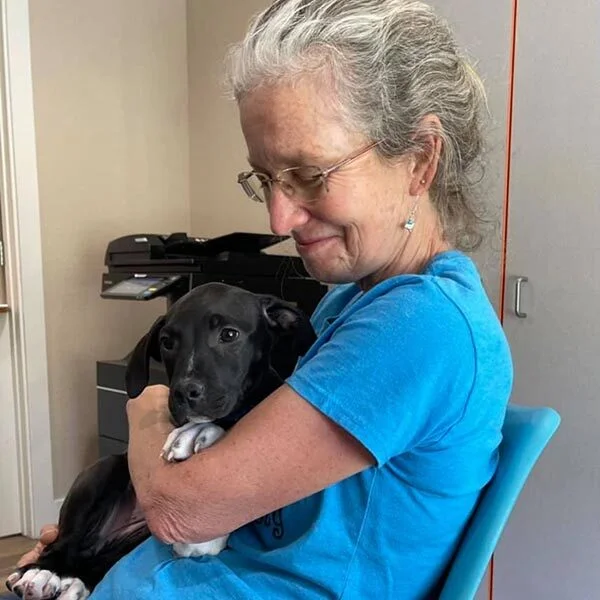 Volunteer Kathleen with puppy Sissy